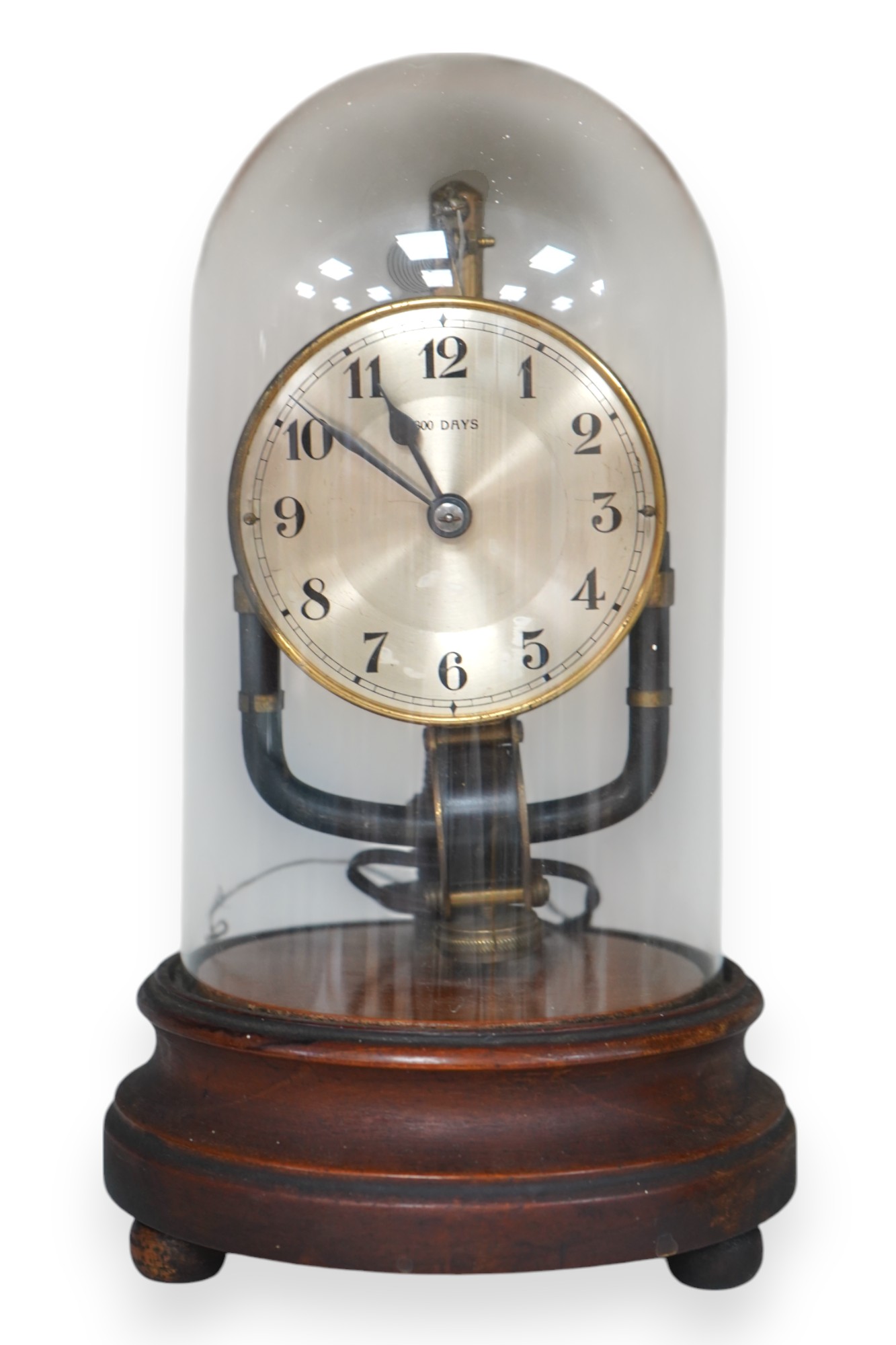 A Bulle type 800 day electric clock, under a glass dome, 26cm high. Condition - fair, untested